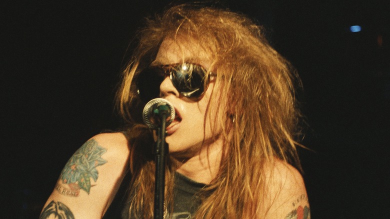 Axl Rose singing with sunglasses
