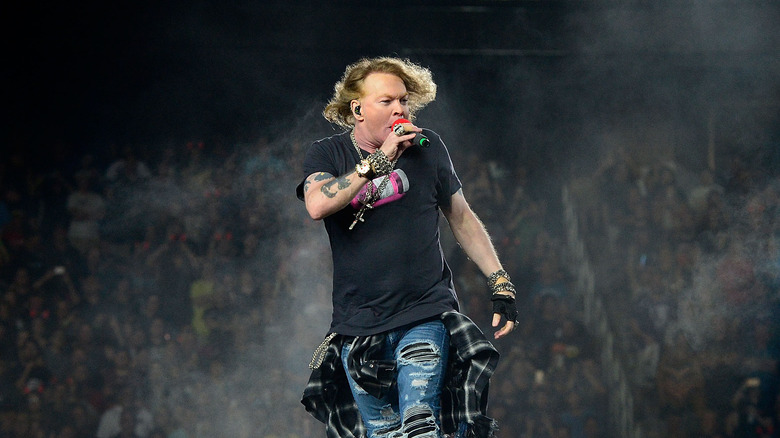 axl rose black shirt mic singing onstage