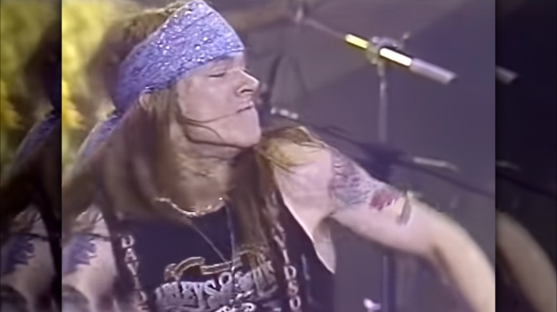 axl rose young long hair performing onstage