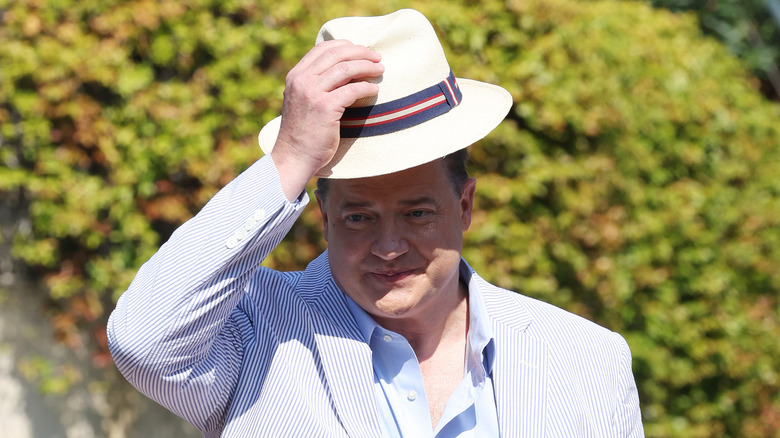 Brendan Fraser, tipping his hat in greeting.