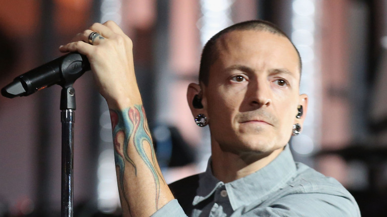 Chester Bennington holding a microphone