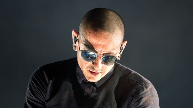 Chester Bennington bald sunglasses looking down