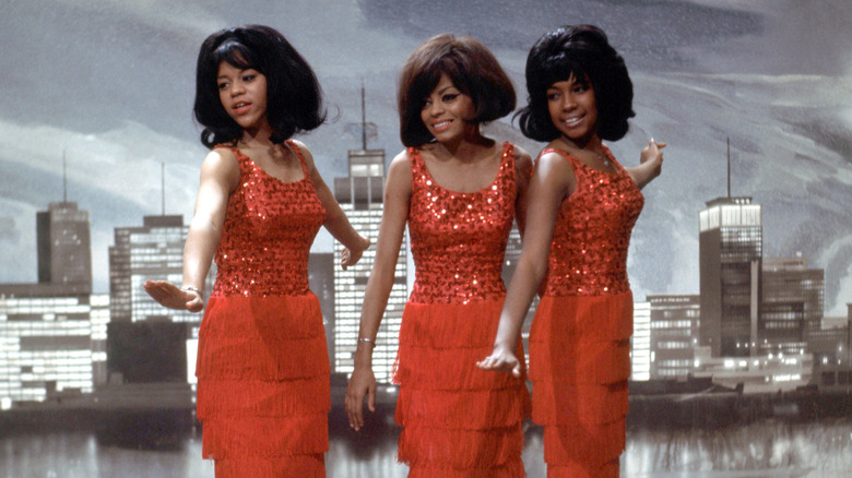Diana Ross and the Supremes city skyline red dresses