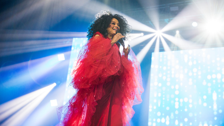 Diana Ross performing red fluffy dress