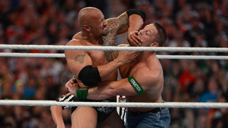 Dwayne Johnson wrestling John Cena