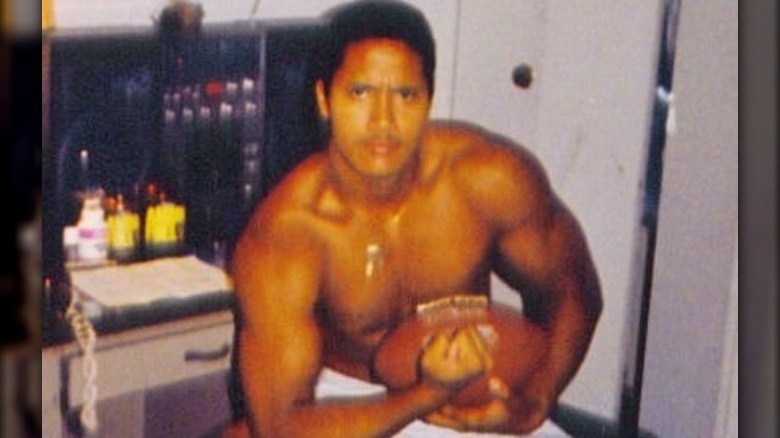 Dwayne Johnson with a football