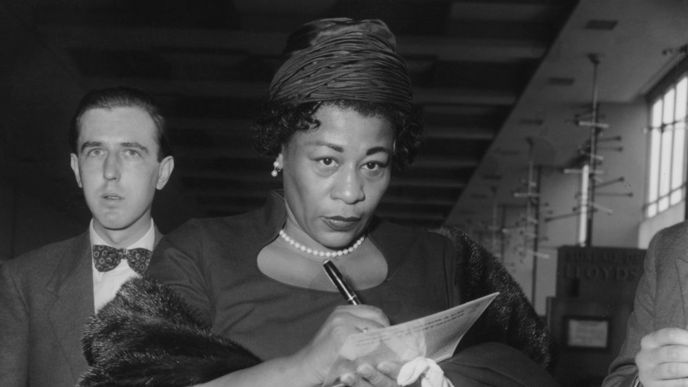 Ella Fitzgerald signs an autograph