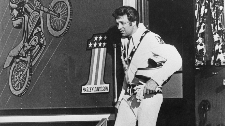 Evel Knievel in the doorway of his custom trailer in 1972