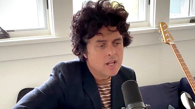 billie joe armstrong singing into microphone