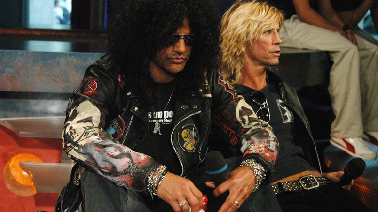 Slash and Duff McKagan sitting side-by-side