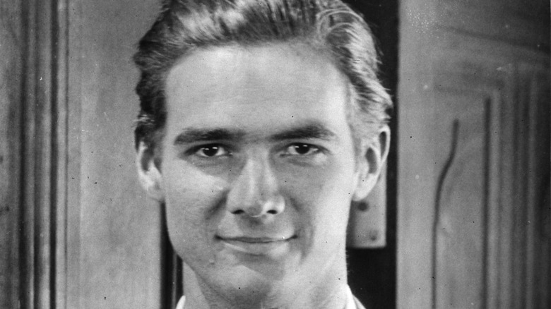 young Howard Hughes smiling