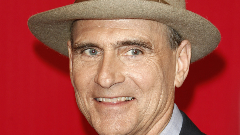 James Taylor smiling in hat