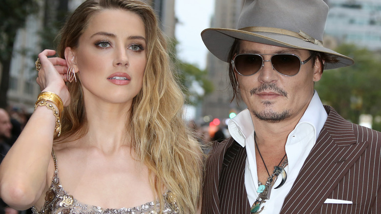 amber heard and johnny depp attending the danish girl film premiere 