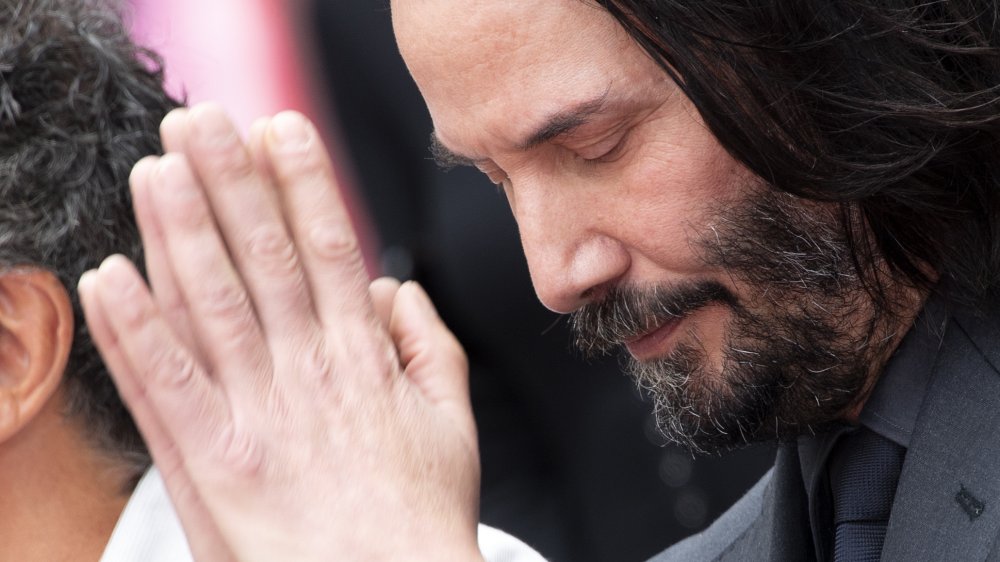 keanu reeves praying