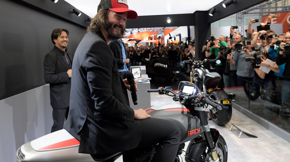 keanu reeves sitting on bike