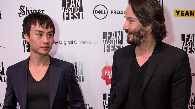 keanu reeves smiling with Tiger Hu Chen