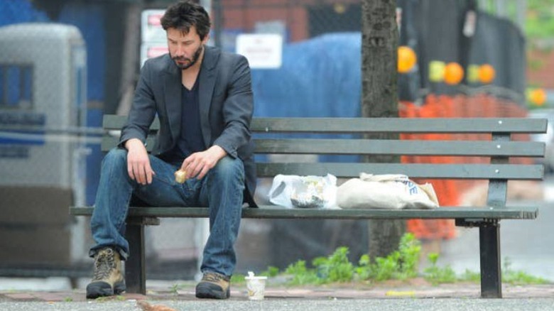 sad keanu meme sitting on bench