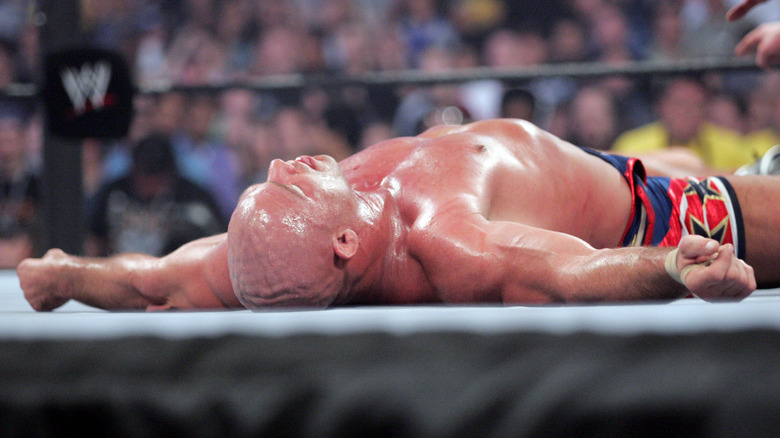 Kurt Angle lying in the ring exhausted