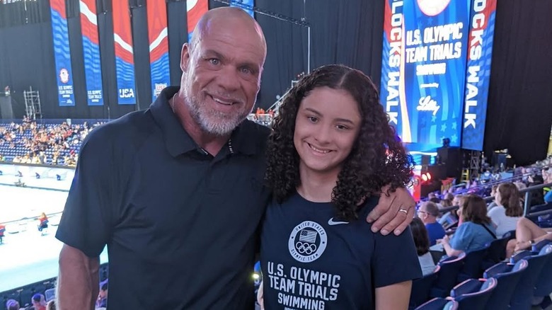 Kurt Angle with his arm around his daughter Guiliana