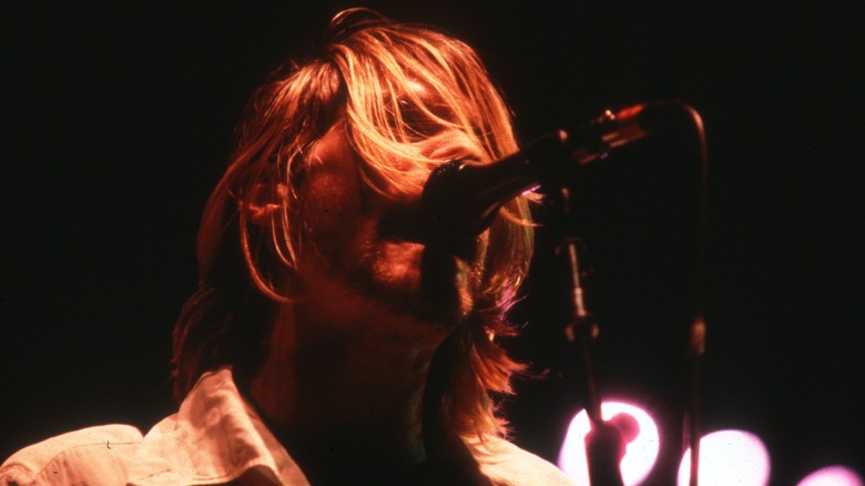  Kurt Cobain singing at microphone 