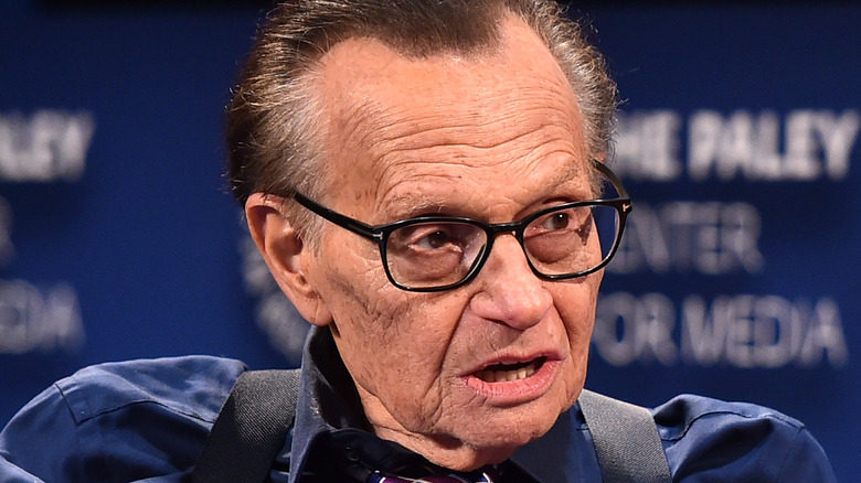 Larry King blue shirt explaining