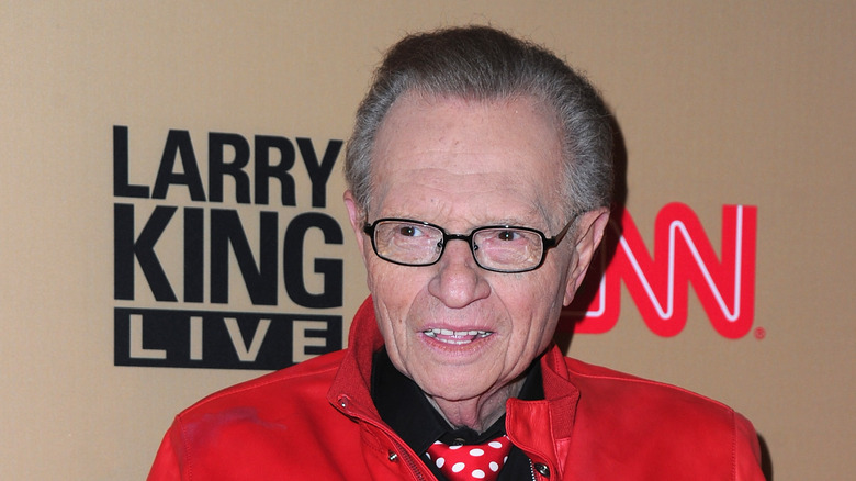 Larry King red leather jacket at CNN event