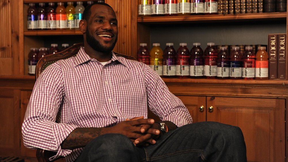 LeBron James sat red checkered shirt smiling