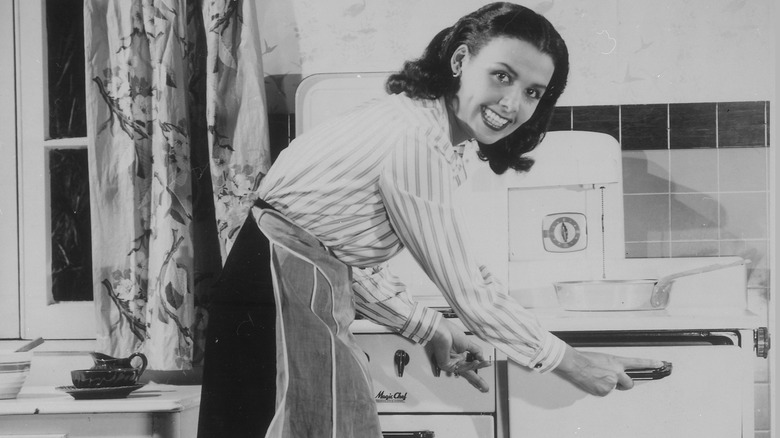 Lena Horne smiling in kitchen 