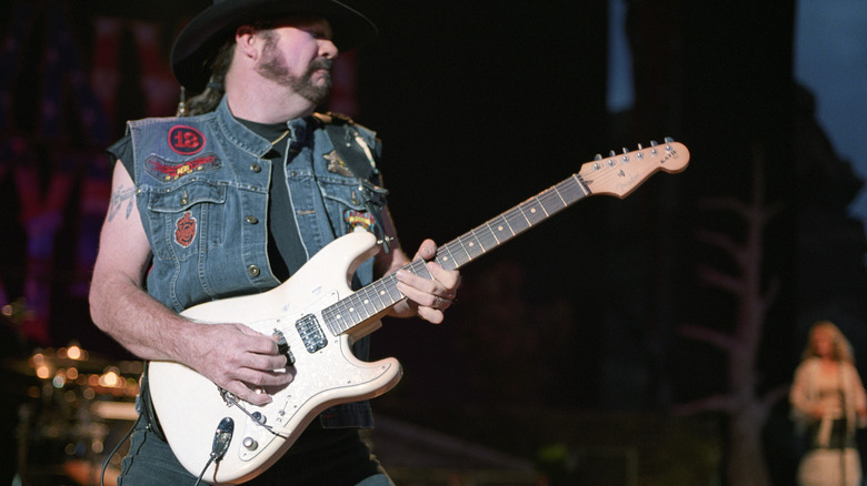 Hughie Thomasson playing guitar