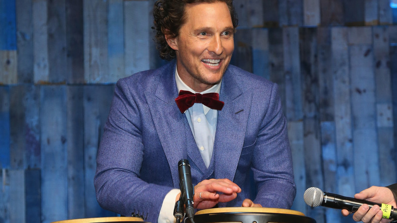 Matthew McConaughey playing bongos