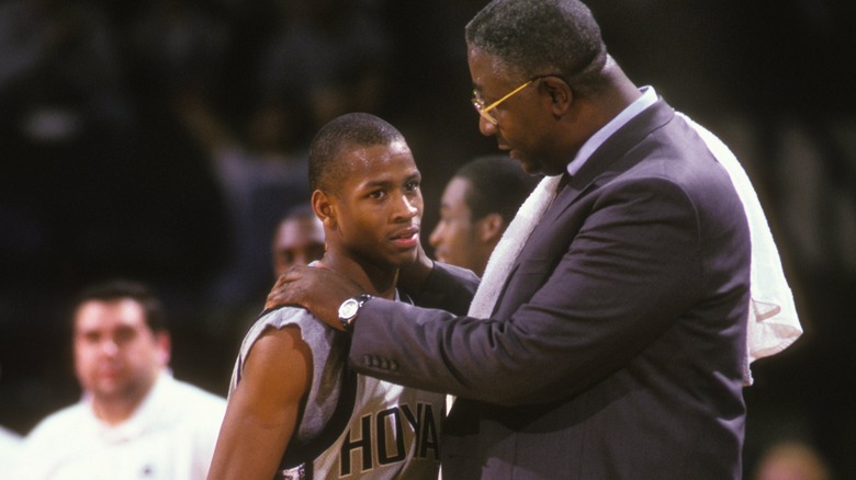 John Thompson hands on Allen Iverson shoulders 