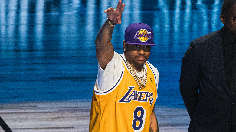 Allen Iverson arm raised Lakers jersey purple hat