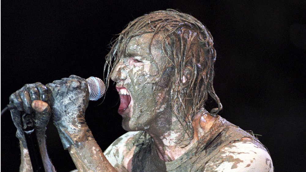 Trent Reznor covered in mud