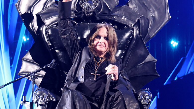 Ozzy Osbourne sitting on a bat-winged throne