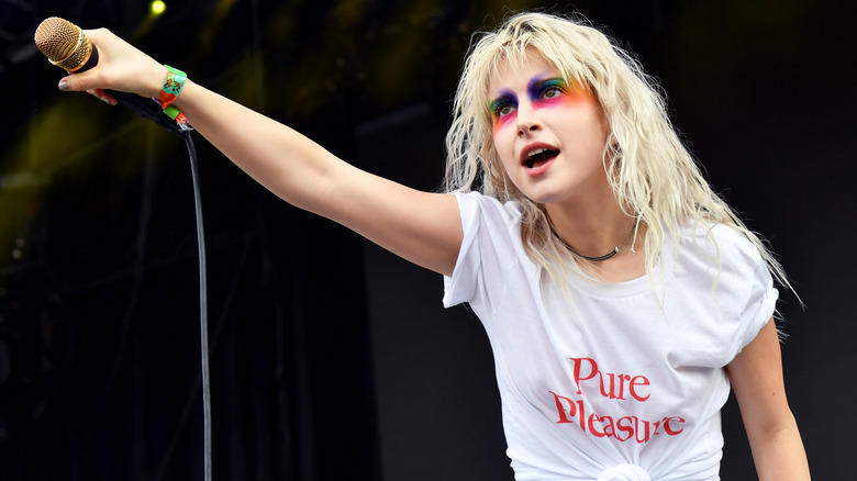 Hayley Williams rainbow makeup mic raised to crowd