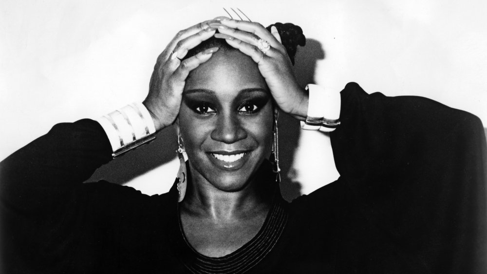 young Patti LaBelle with hands on head