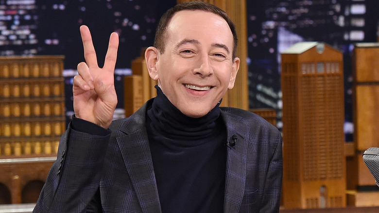 Paul Reubens giving the peace sign