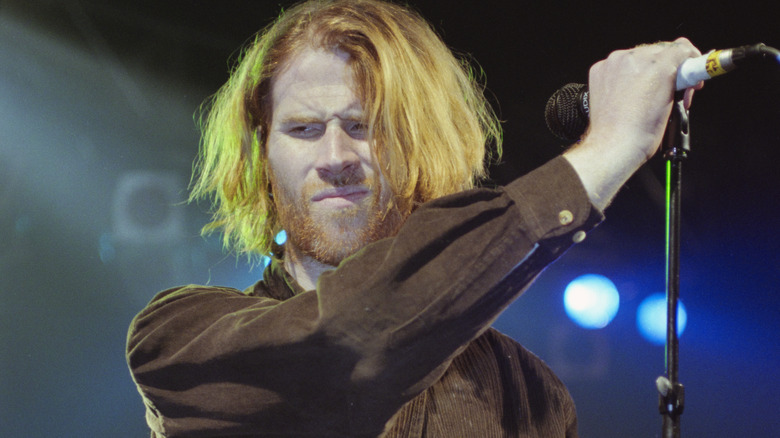 Mark Lanegan holding mic