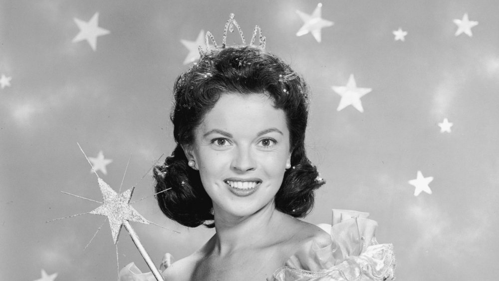 American actor Shirley Temple wears a fairy godmother costume, 