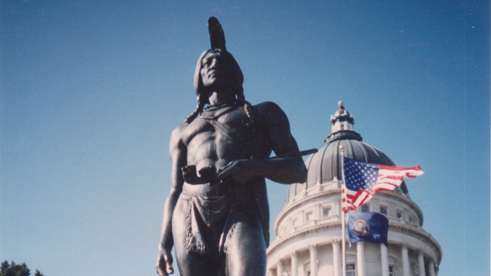 massasoit statue in front of building