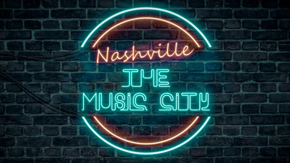 Neon sign reading Nashville The Music City