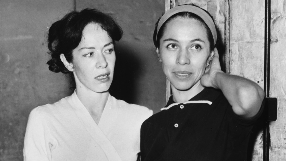 Marjorie Tallchief standing next to and looking at her sister Maria Tallchief 