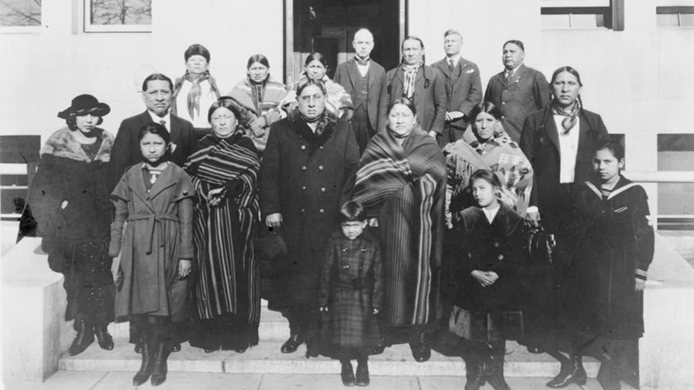 Group of 15 from the Osage Nation posing on steps