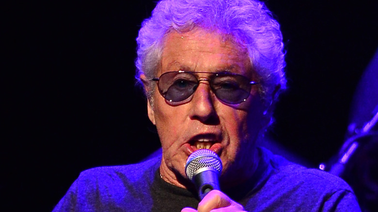 Roger Daltrey singing purple lighting