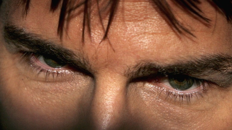 Tom Cruise's eyes fall into a shaft of light