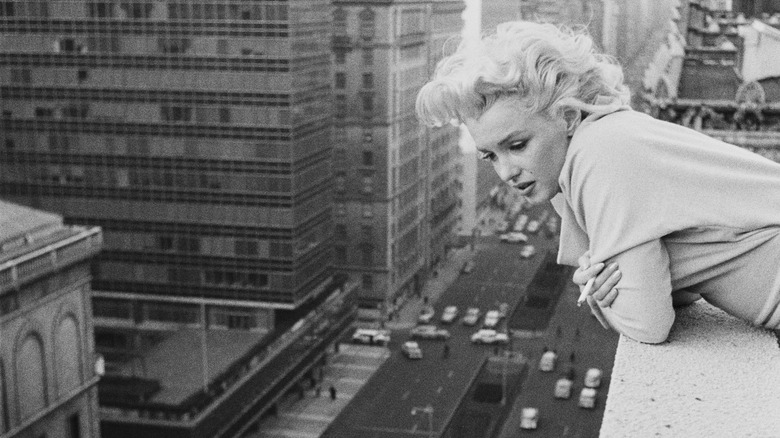 Marilyn Monroe looking down from rooftop 