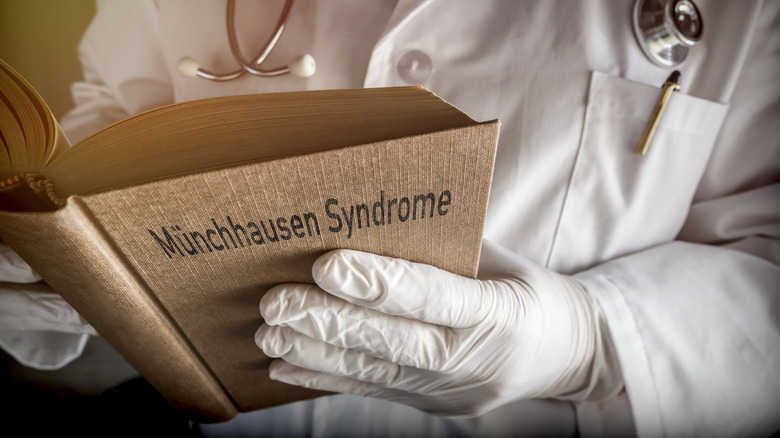 A doctor studies Munchausen syndrome book