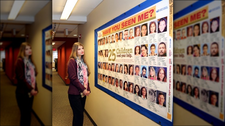 Alicia_Kozakiewicz looking at a poster at the National Center for Missing and Exploited Children