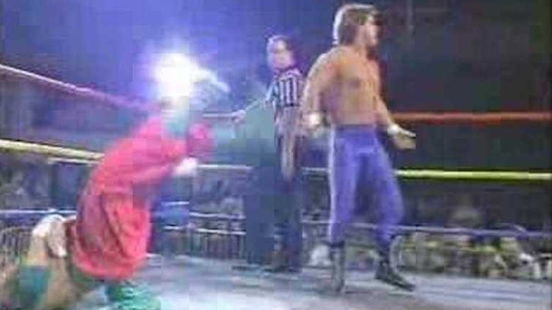 Chris Benoit poses after Sabu breaks neck