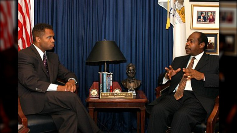 Jesse Jackson Jr. and Paul Rusesabagina talking